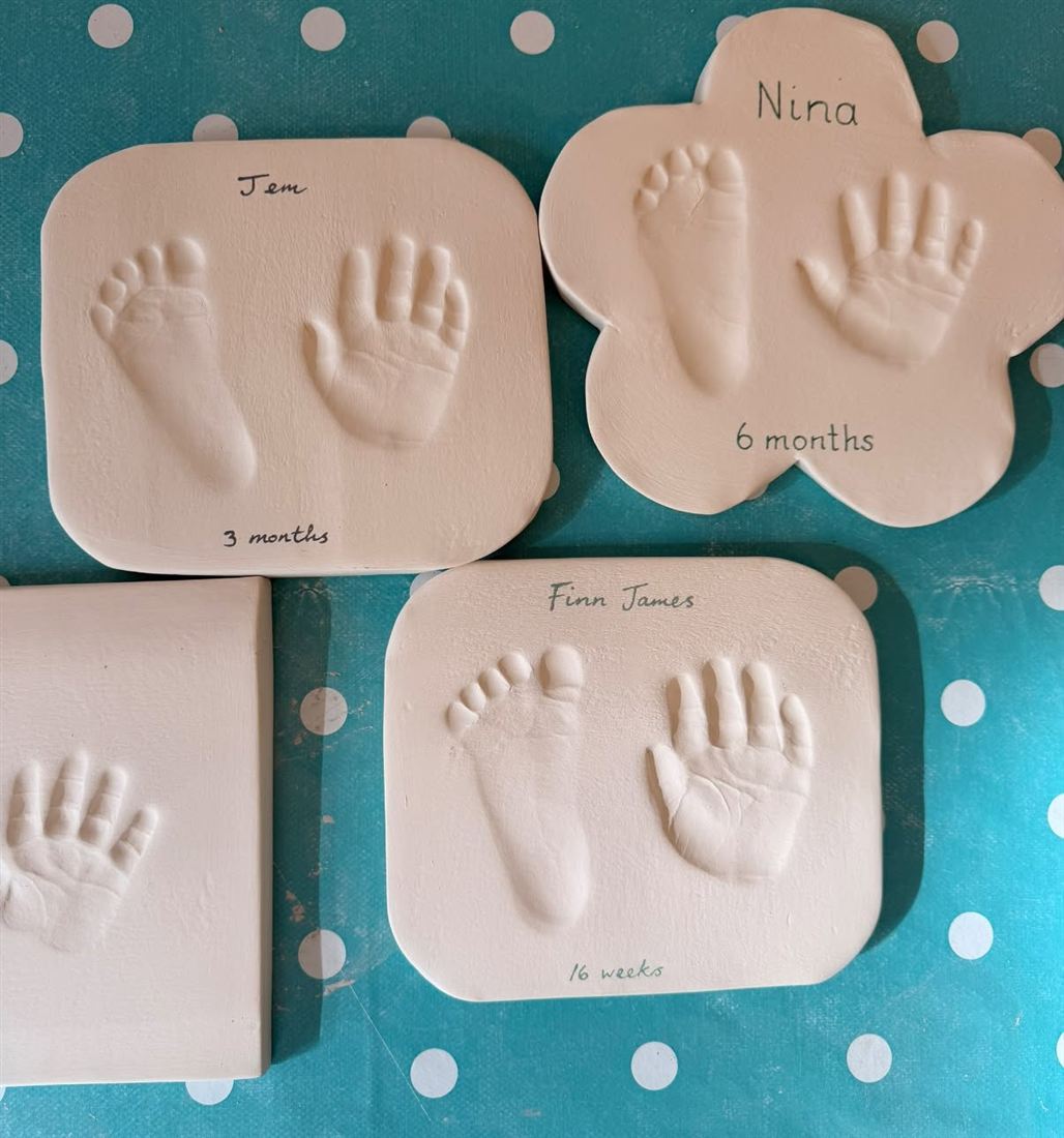 Clay impressions of babies' hands and feet